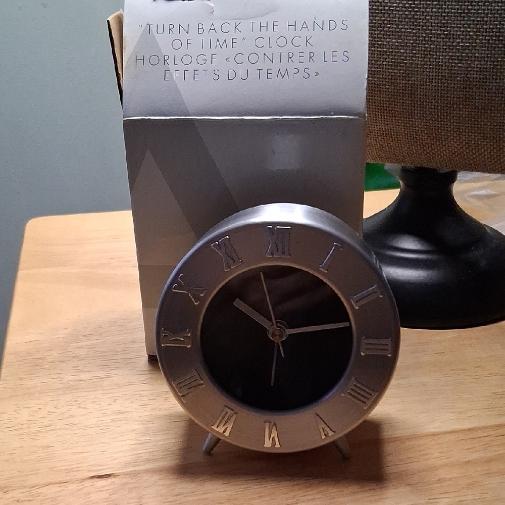 Avon Silver Roman Numeral Clock.